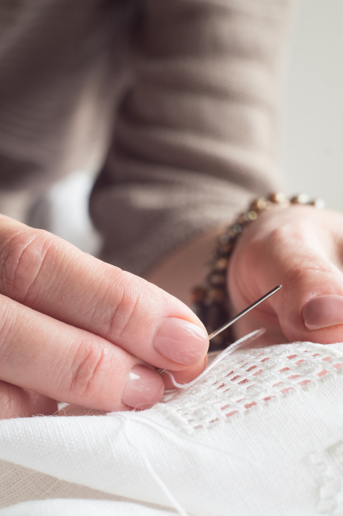 Close-up of hand embroidery on linen